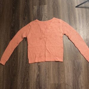Gently worn pink sweater